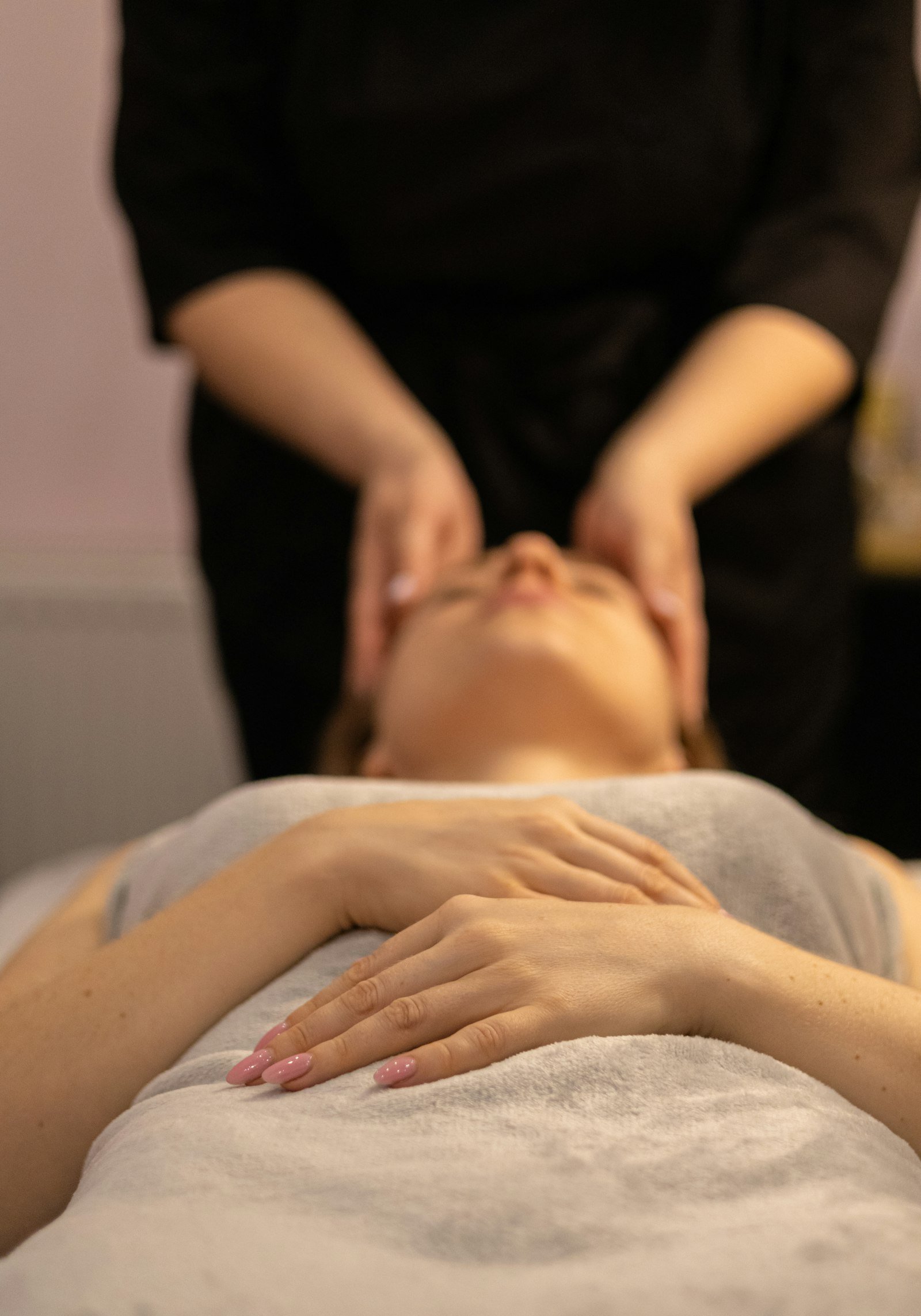 Gentle cranial osteopathy technique, hands cradling a patient's head